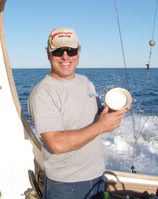 Diver Charlie Bulloss shows off the china bowl he recovered from the Manuela, DiveHatteras photo